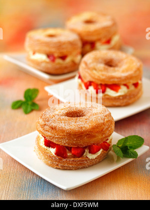 Cronuts with strawberries and mascarpone. Recipe available. Stock Photo