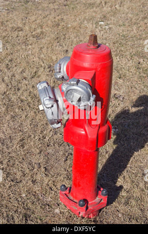 new red fire hydrant water pipe on street Stock Photo