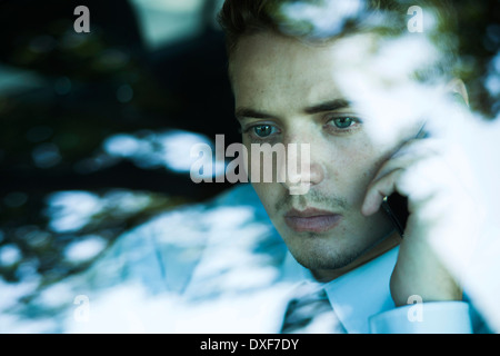 Businessman using Cell Phone and Driving, Mannheim, Baden-Wurttemberg, Germany Stock Photo