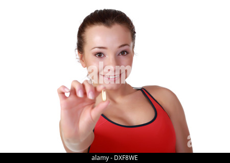 Female fitness model with Omega-3 acid pills Stock Photo