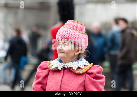An elderly Russian lady dressed in pink and celebrating the festival Maslenitsa. Stock Photo