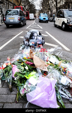 Flowers and tributes left at the accident site where John Clarke a motorcyclist died. Stock Photo
