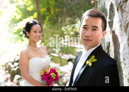 Portrait of Groom with Bride in the background, Toronto, Ontario, Canada Stock Photo