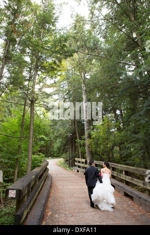 Married Couple Walking over Bridge, Toronto, Ontario, Canada Stock Photo