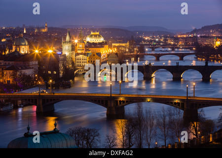 the Manes, Charles and Legion Bridges over the Vltava River at dusk, with the Old Town on the left, Prague, Czech Republic