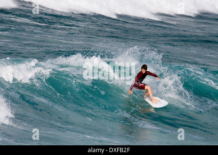 Surfing off Fistral Beach in Newquay in Cornwall, United Kingdom Stock Photo