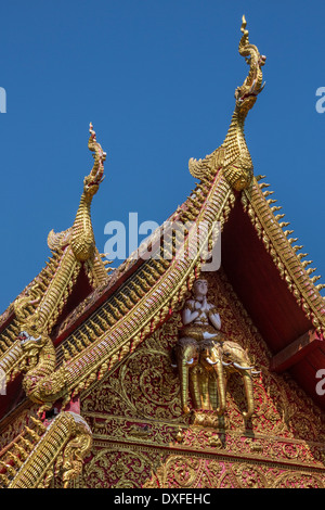 Ornate Thai Architecture - Roof detail at Wat Gate Karan Buddhist temple in the city of Chiang Mai in northern Thailand. Stock Photo