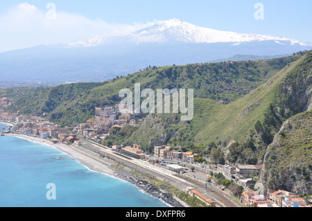 Mediterranean coastline of Sicily with Mount Etna in the background. Stock Photo