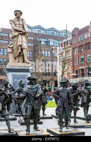 Statue of Rembrandt surrounded by figures from his painting The Night Watch standing in Rembrandtplein in Amsterdam Stock Photo