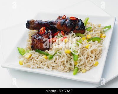 Noodles With Sticky Chicken Drumsticks Stock Photo