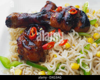 Noodles With Sticky Chicken Drumsticks Stock Photo