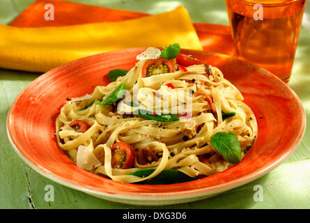 Plate Of Fettuccine With Anchovies And Basil Stock Photo