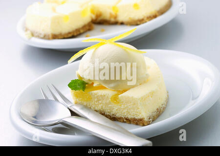 Slice Of Fresh Lemon Cheesecake On Plate Stock Photo