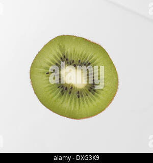 Slice Of Kiwi Fruit On White Background Stock Photo