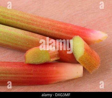 Sliced Stalks Of Rhubarb On Wooden Surface Stock Photo
