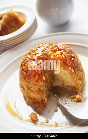 Bowl Of Steamed Syrup Pudding With Jug Of Custard Stock Photo - Alamy