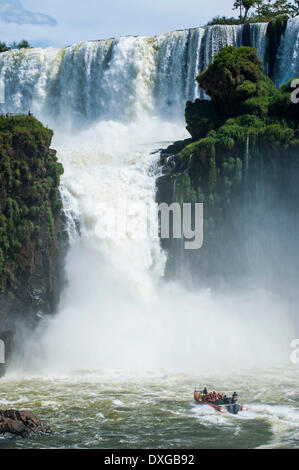 Jetboat underneath the Iguazú Falls, Iguazú National Park, UNESCO World Heritage Site, Argentina Stock Photo