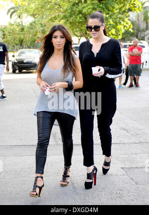 Kim Kardashian and Khloe Kardashian leaving a cafe with Cuban coffee, during filming for 'Kourtney and Kim Take Miami' Miami Florida - 13.10.12 Featuring: Kim Kardashian and Khloe Kardashian When: 13 Oct 2012 Stock Photo