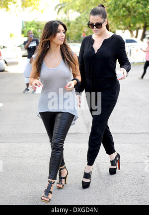 Kim Kardashian and Khloe Kardashian leaving a cafe with Cuban coffee, during filming for 'Kourtney and Kim Take Miami' Miami Florida - 13.10.12 Featuring: Kim Kardashian and Khloe Kardashian When: 13 Oct 2012 Stock Photo