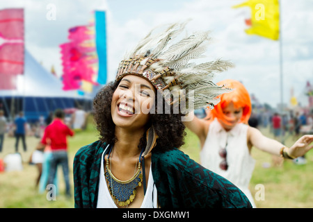 Women in costumes dancing at music festival Stock Photo