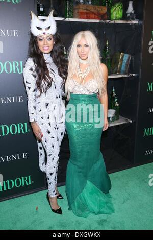 Lala Anthony and Kim Kardashian dressed as a mermaid attends the Midori Halloween party Featuring: Lala Anthony and Kim Kardash Stock Photo