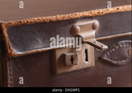 old fashioned leather handmade suitcase with latches lock and handle used by doctor formal statement Stock Photo