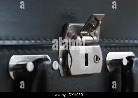 old fashioned leather handmade suitcase with latches lock and handle used by doctor formal statement Stock Photo