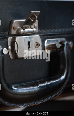old fashioned leather handmade suitcase with latches lock and handle used by doctor formal statement Stock Photo