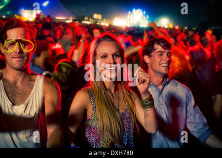 Fans dancing at music festival Stock Photo