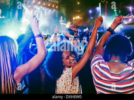 Portrait of cheering woman at music festival Stock Photo