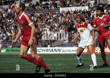 football, Bundesliga, 1983/1984, Rhine Stadium, Fortuna Duesseldorf versus Hamburger SV 2:3, scene of the match, f.l.t.r. Dietmar Jakobs (HSV), Ruediger Wenzel (Fortuna), William Hartwig (HSV) Stock Photo