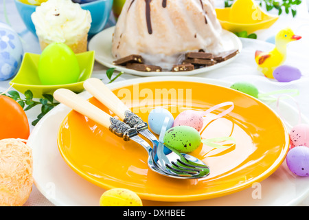 Easter table arrangement with eggs and sweets Stock Photo