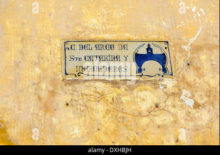 Street sign for Calle del Arco de Santa Catarina y Mercaderes, the Saint Catalina Arch, in Calle 2. Antigua Guatemala, Stock Photo