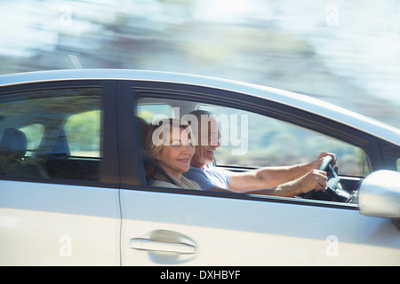 Happy senior couple driving in car Stock Photo