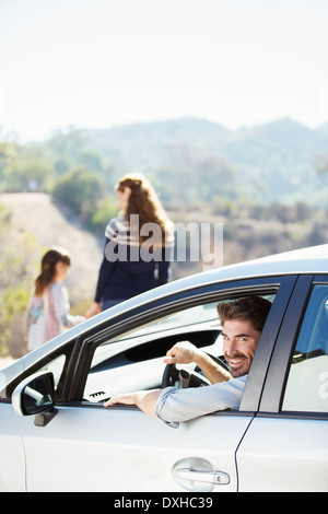 Portrait of happy man inside of car Stock Photo