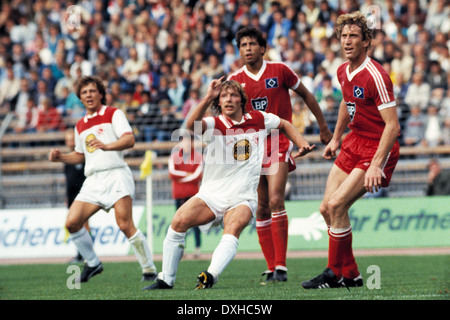 football, Bundesliga, 1983/1984, Rhine Stadium, Fortuna Duesseldorf versus Hamburger SV 2:3, scene of the match, f.l.t.r. Josef Weikl (Fortuna), Ruediger Wenzel (Fortuna), William Hartwig (HSV), Ditmar Jakobs (HSV) Stock Photo