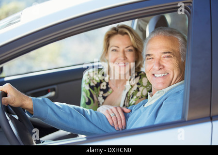 Portrait of happy senior couple in car Stock Photo