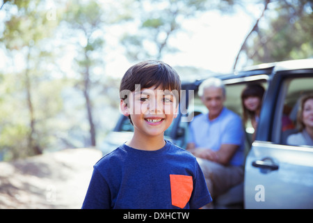 Portrait of smiling boy outside car Stock Photo