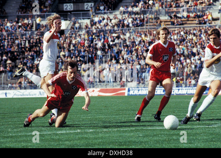 football, Bundesliga, 1983/1984, Rhine Stadium, Fortuna Duesseldorf versus Hamburger SV 2:3, scene of the match, f.l.t.r. Gerd Zewe (Fortuna), Juergen Groh (HSV), Wolfgang Rolff (HSV), Holger Fach (Fortuna) Stock Photo