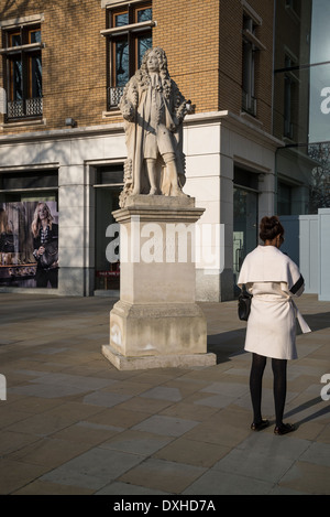 Sir Hans Sloane statue and woman with her back towards the camera, King's Rd, London, UK Stock Photo