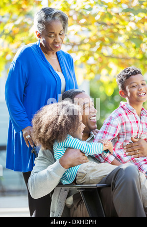 Happy grandparents and grandchildren outdoors Stock Photo