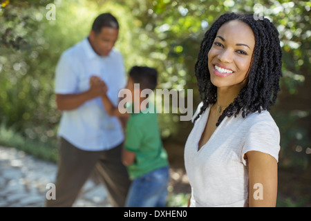 Portrait of smiling woman outdoors Stock Photo