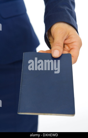 Closeup on business woman giving passport Stock Photo