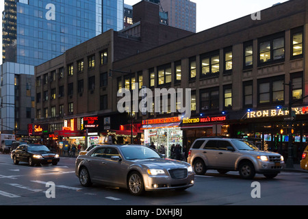 Traffic and Street Scene at Dusk, 8th Avenue Near Times Square, NYC, USA Stock Photo