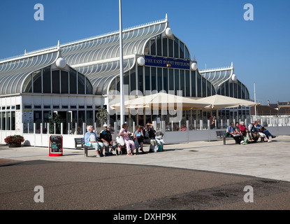 People sitting on benches enjoying sunny weather at East Point Pavilion, Seafront Lowestoft, Suffolk, England, Stock Photo