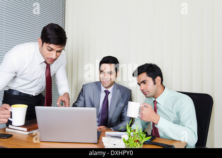 Indian Businessman sitting in Office and Disscussing Stock Photo
