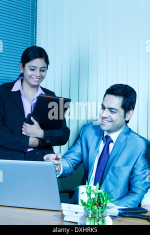 Indian Business People Sitting in Office and Disscussing Stock Photo