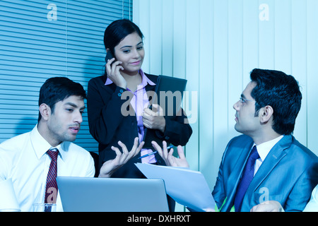 Indian Business People Sitting in Office and Disscussing Stock Photo