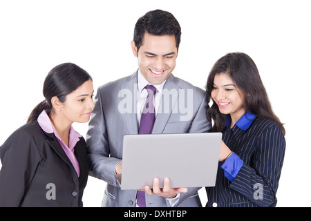 Indian Business People Standing with Laptop Stock Photo