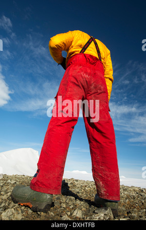 A man from an expedition cruise on Joinville Island just off the Antarctic Peninsular. Stock Photo